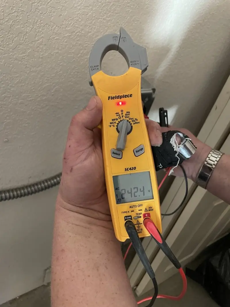 Voltage testing with clamp meter during Generator Installation in Garden City
